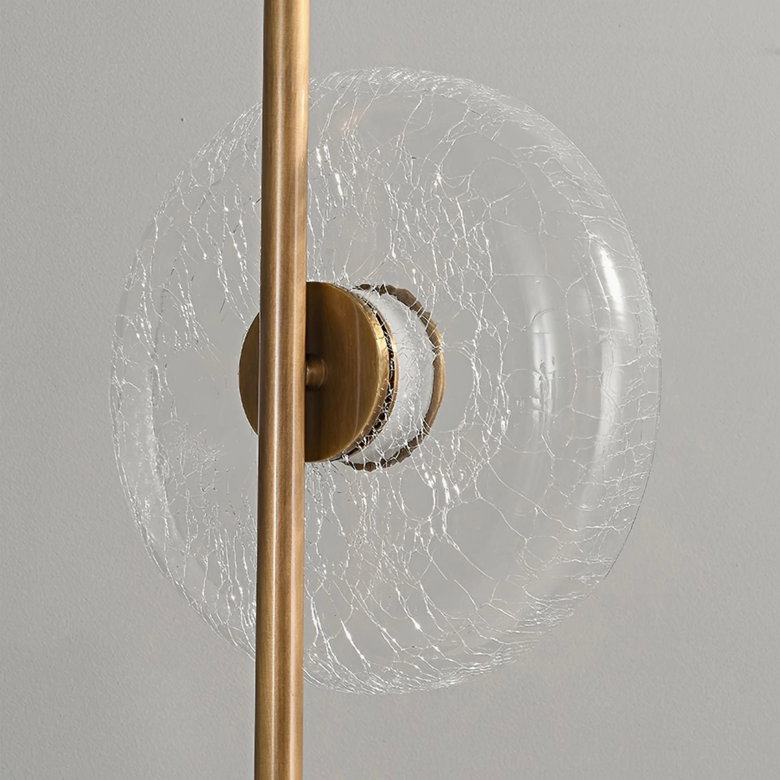 Designer crackle glass floor lamp with integrated LED and bronze finished metal base for contemporary homes