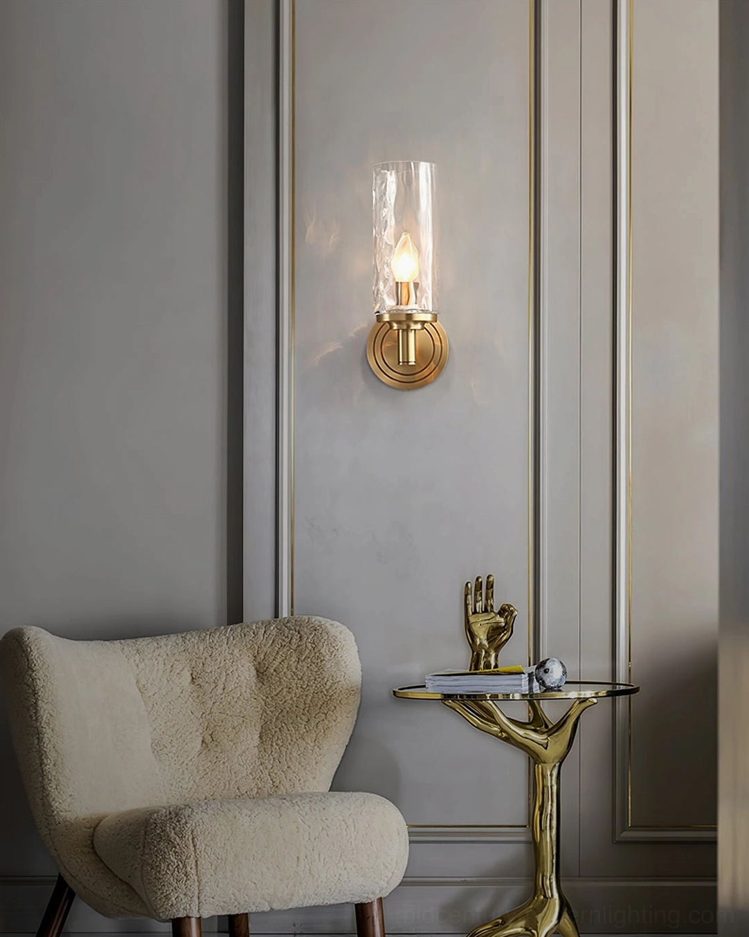 Devora mini brass wall light in luxury living room accent setting with side table