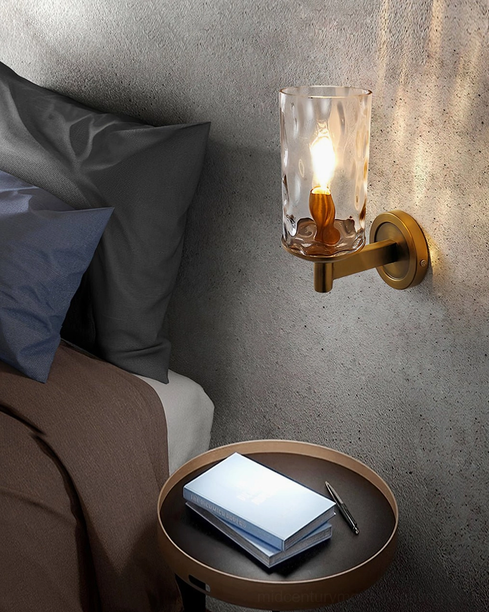 Devora wall lamp bedside close-up, brass rippled glass shade with warm ambient lighting