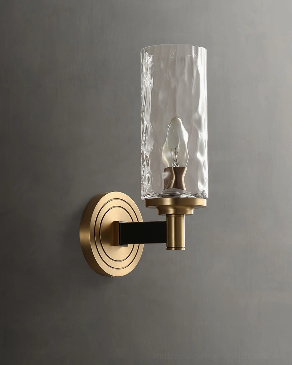 Devora wall sconce design detail showing torch-inspired structure and glass diffuser