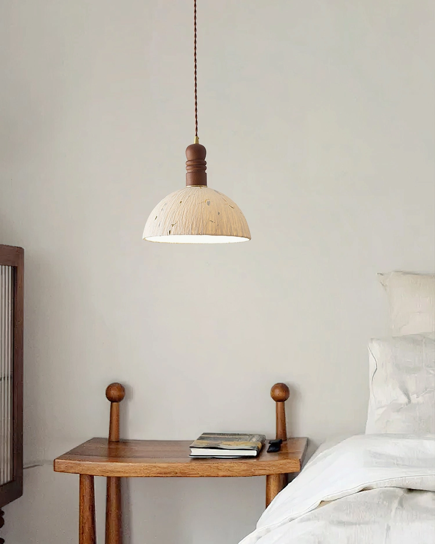 Diana pendant light in Japanese-inspired minimalist bedroom with warm ambient glow and natural decor