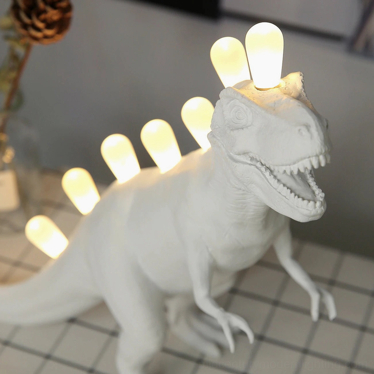 Dinosaur table lamp with gallery lighting, retail boutique display setting