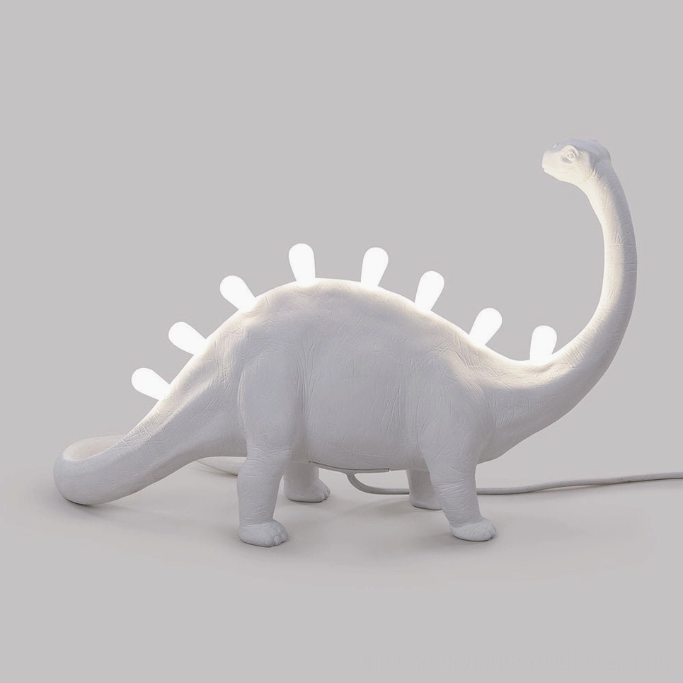 Dinosaur table lamp with integrated LED bulbs, detailed spine illumination view