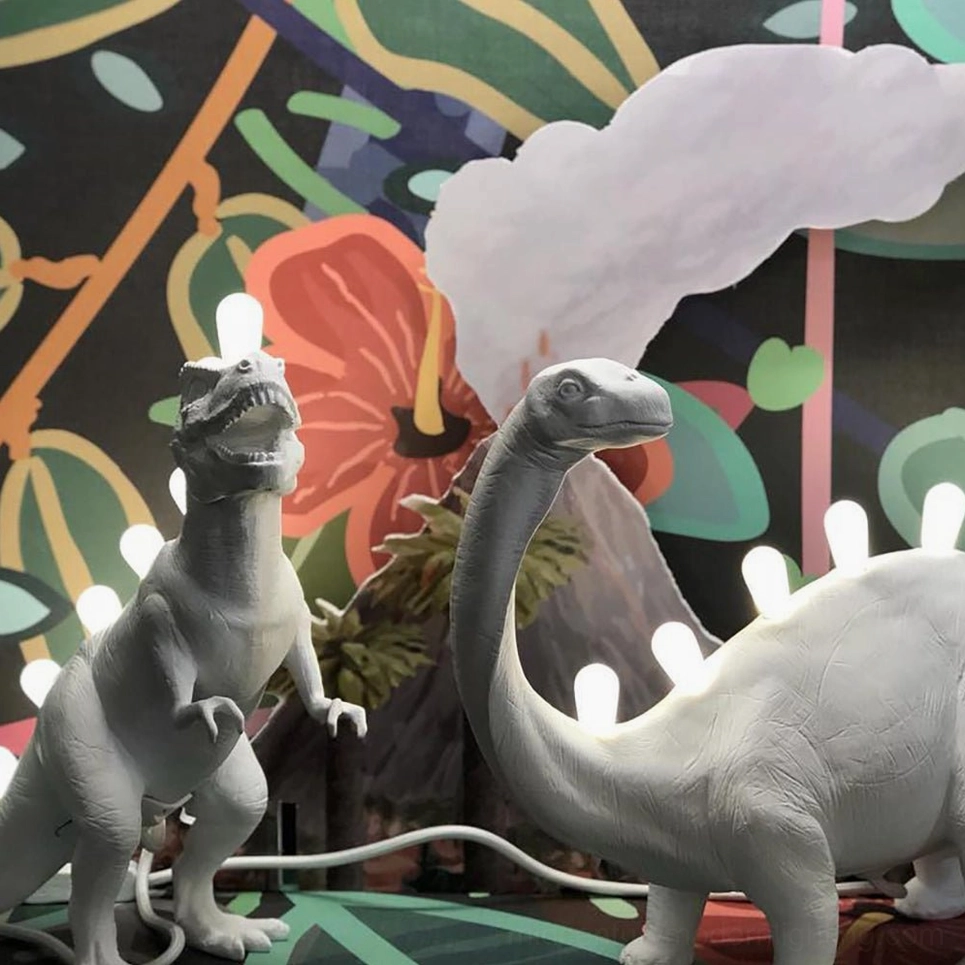 Dinosaur table lamp with warm illumination, cozy reading light ambiance