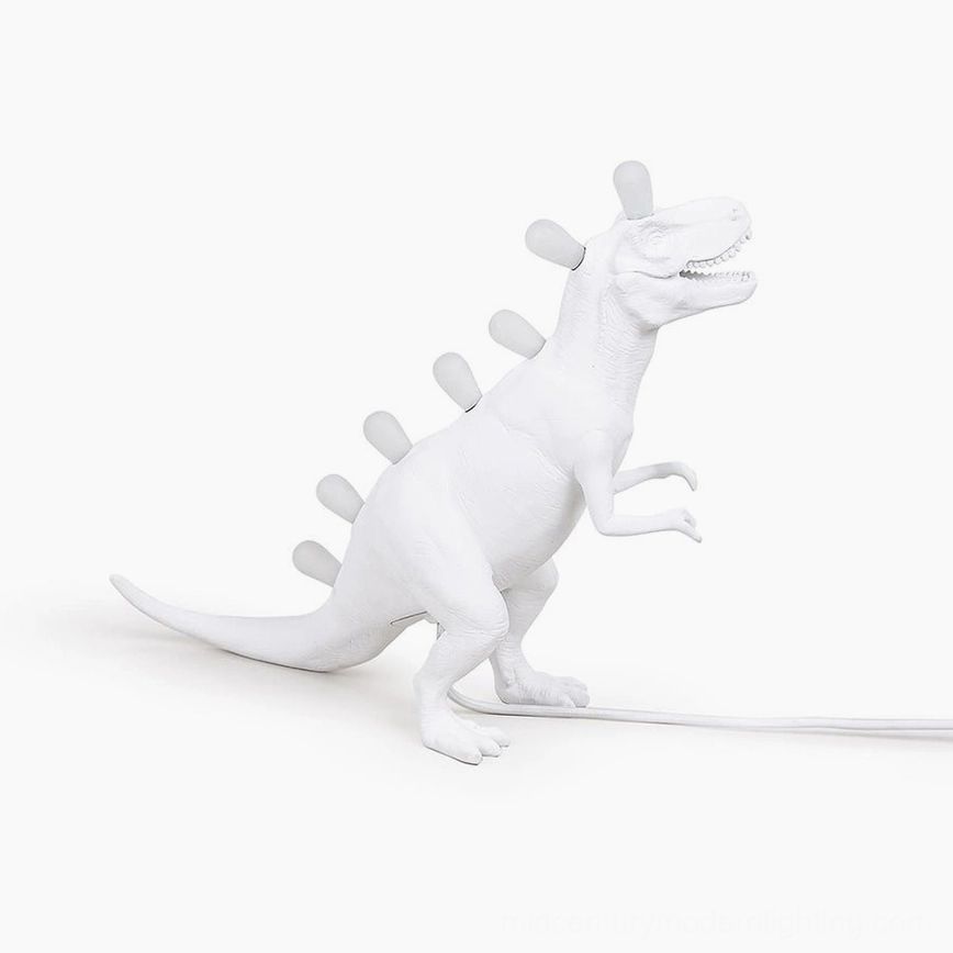 Dinosaur table lamp with natural wood furniture, organic warmth pairing