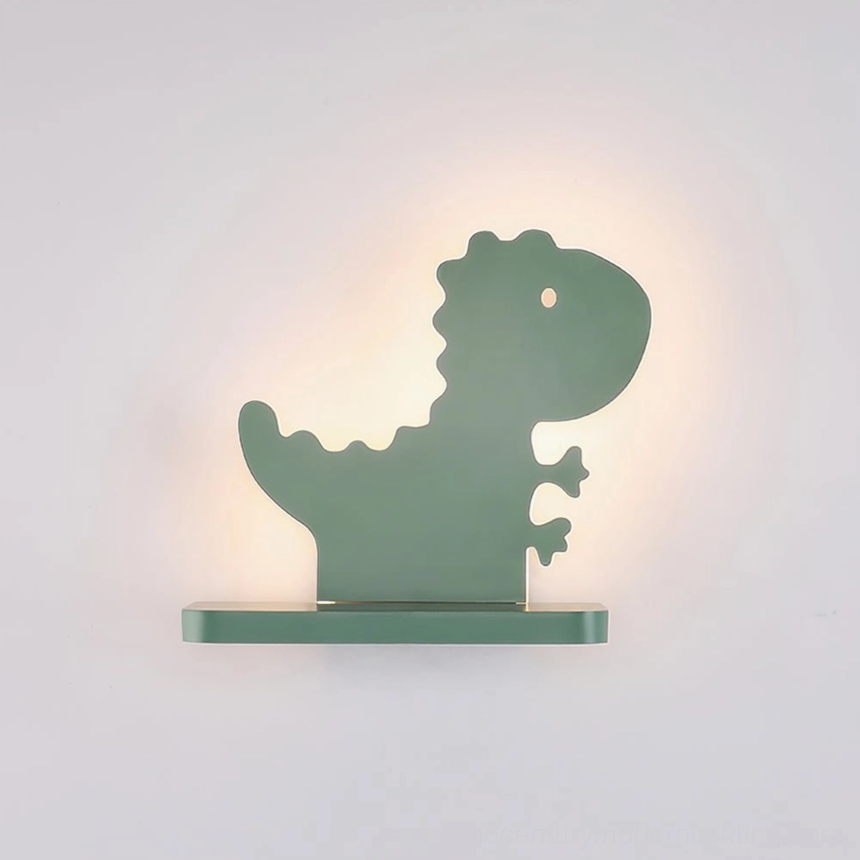 Overhead view of dinosaur wall lamp showing smooth matte sage green acrylic finish and metal construction
