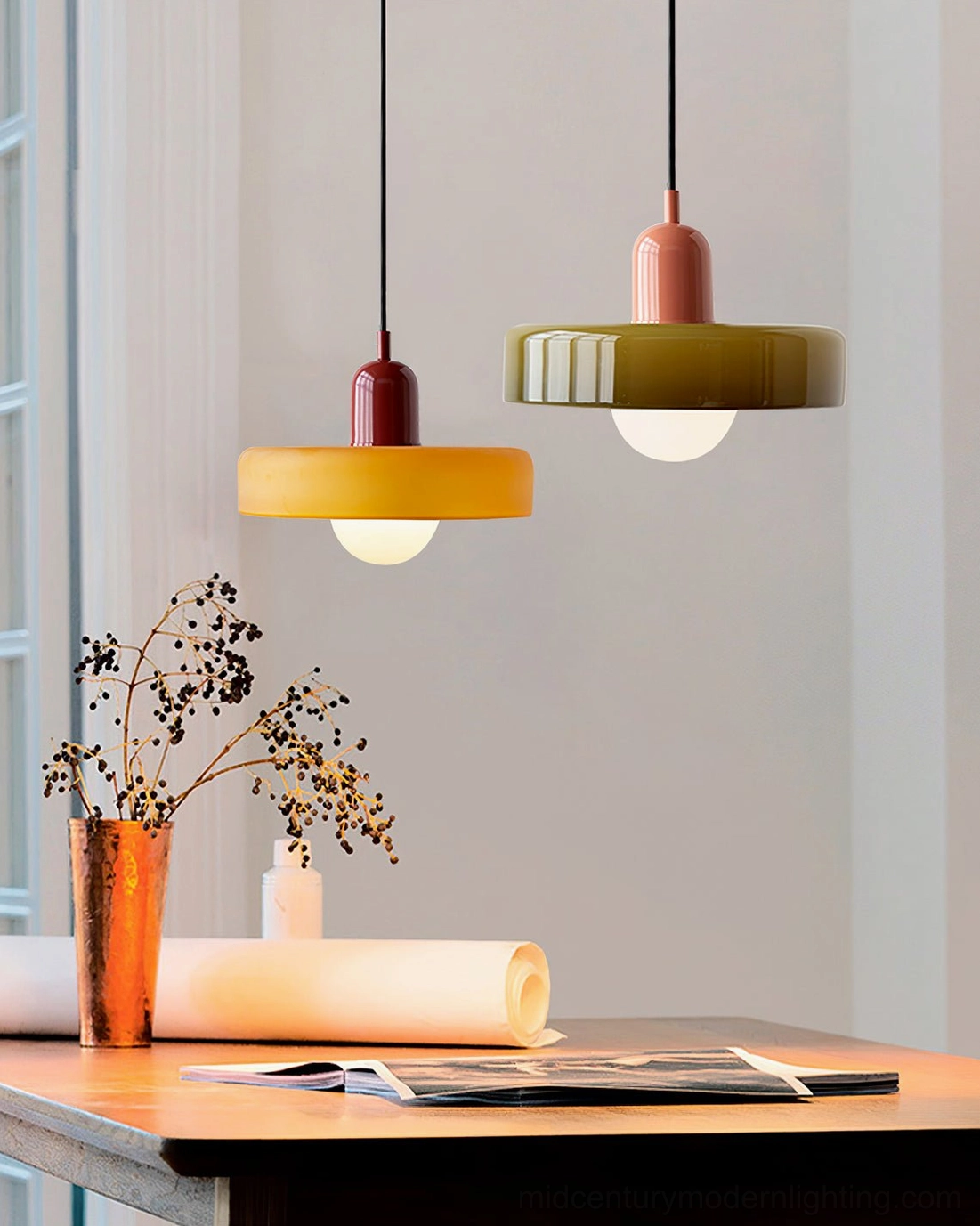 Disc Orb Pendant Lights in mixed finishes above warm wood home studio area