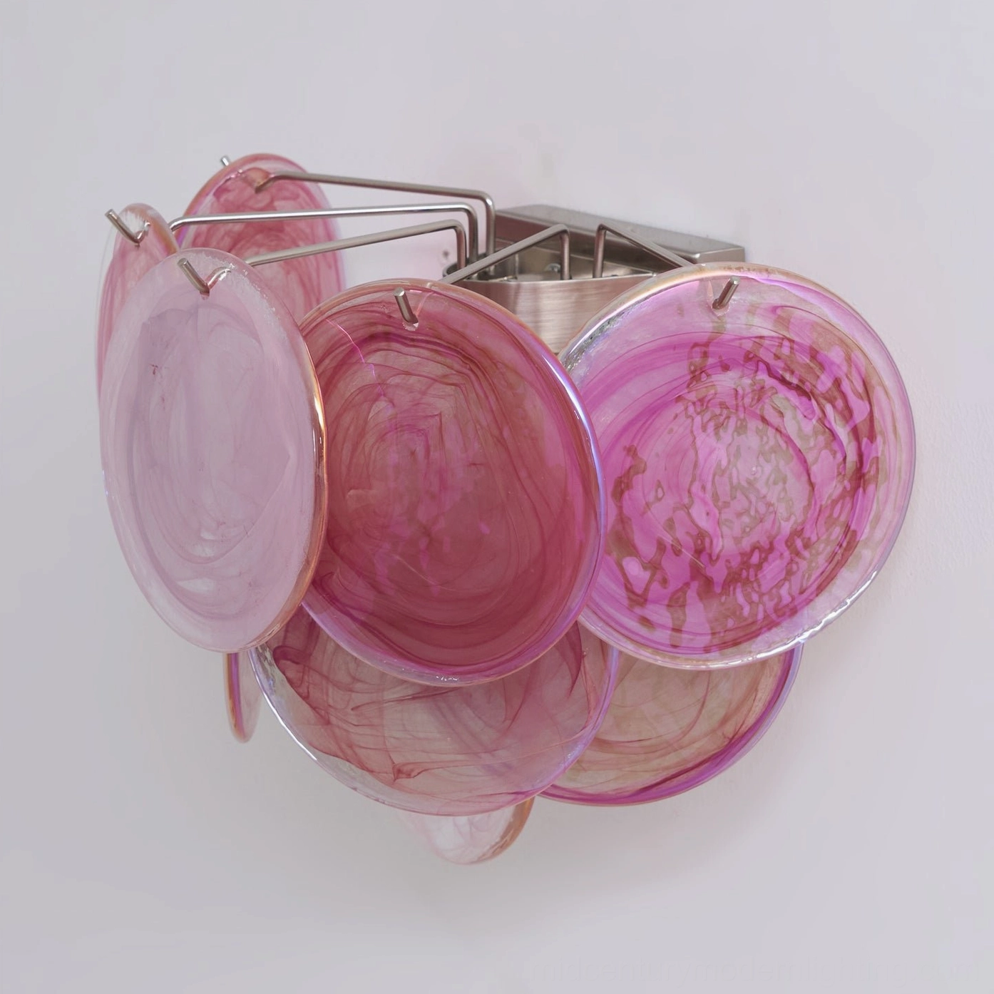 Disc wall lamp handcrafted glass detail, close-up showing artisanal swirled translucent patterns