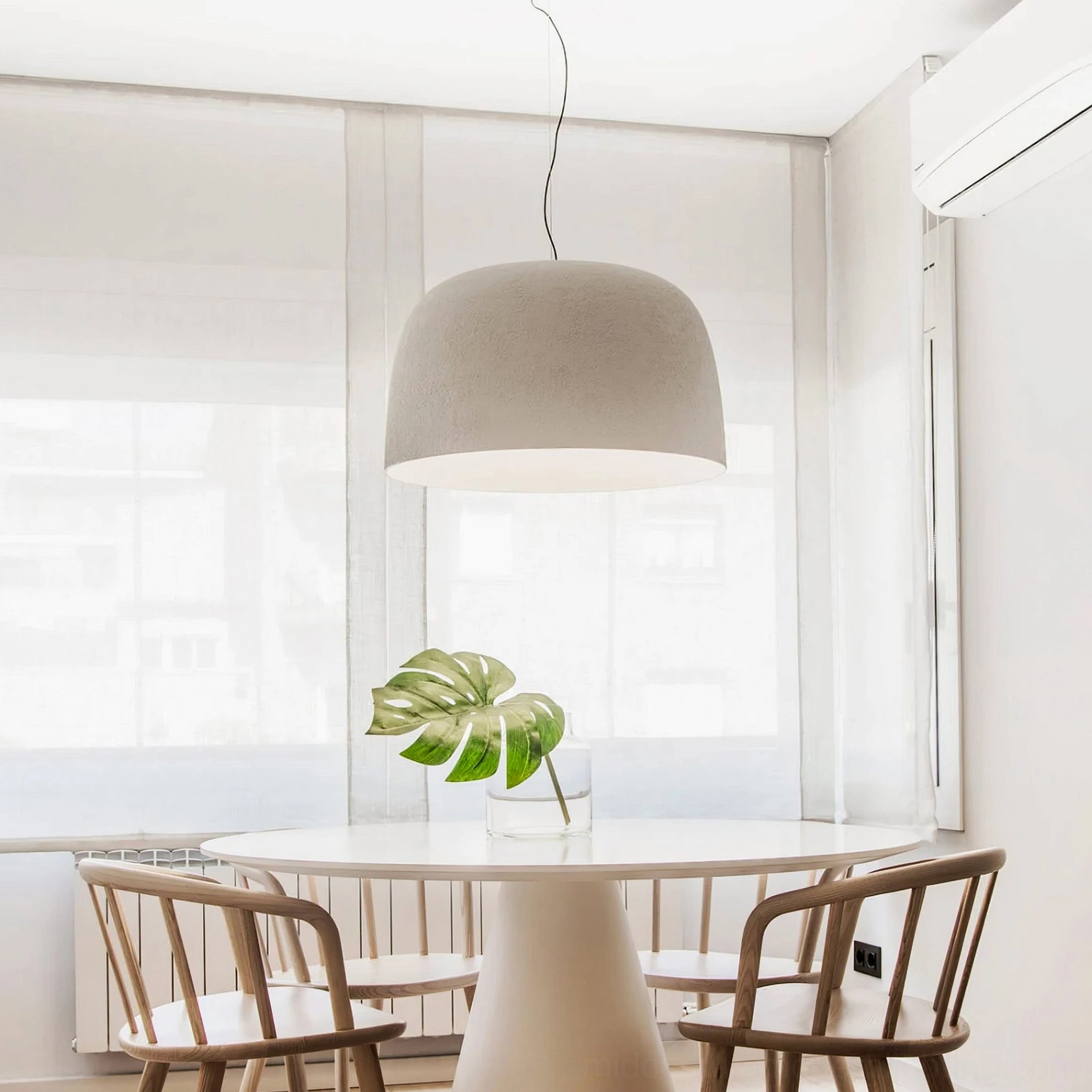 Red Djembe pendant lamp as bold accent in modern interior design showcase