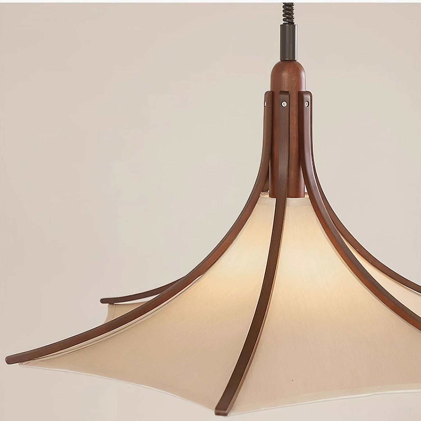 Modern Japandi pendant lamp with curved wooden arms and neutral fabric shade close-up