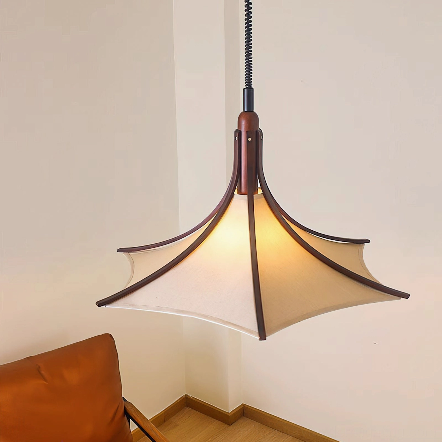 Japandi style pendant lamp with wood accents and neutral fabric shade in residential interior corner