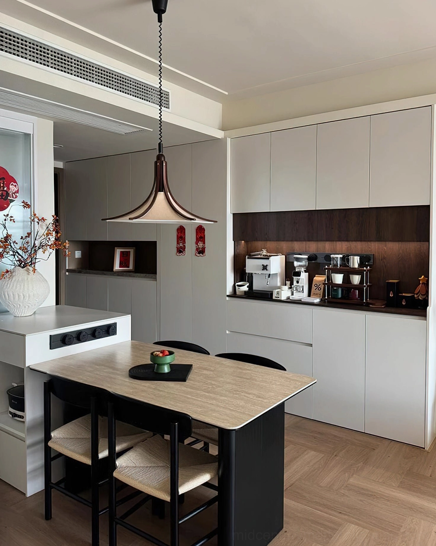 Minimalist retro pendant lighting above kitchen island counter space