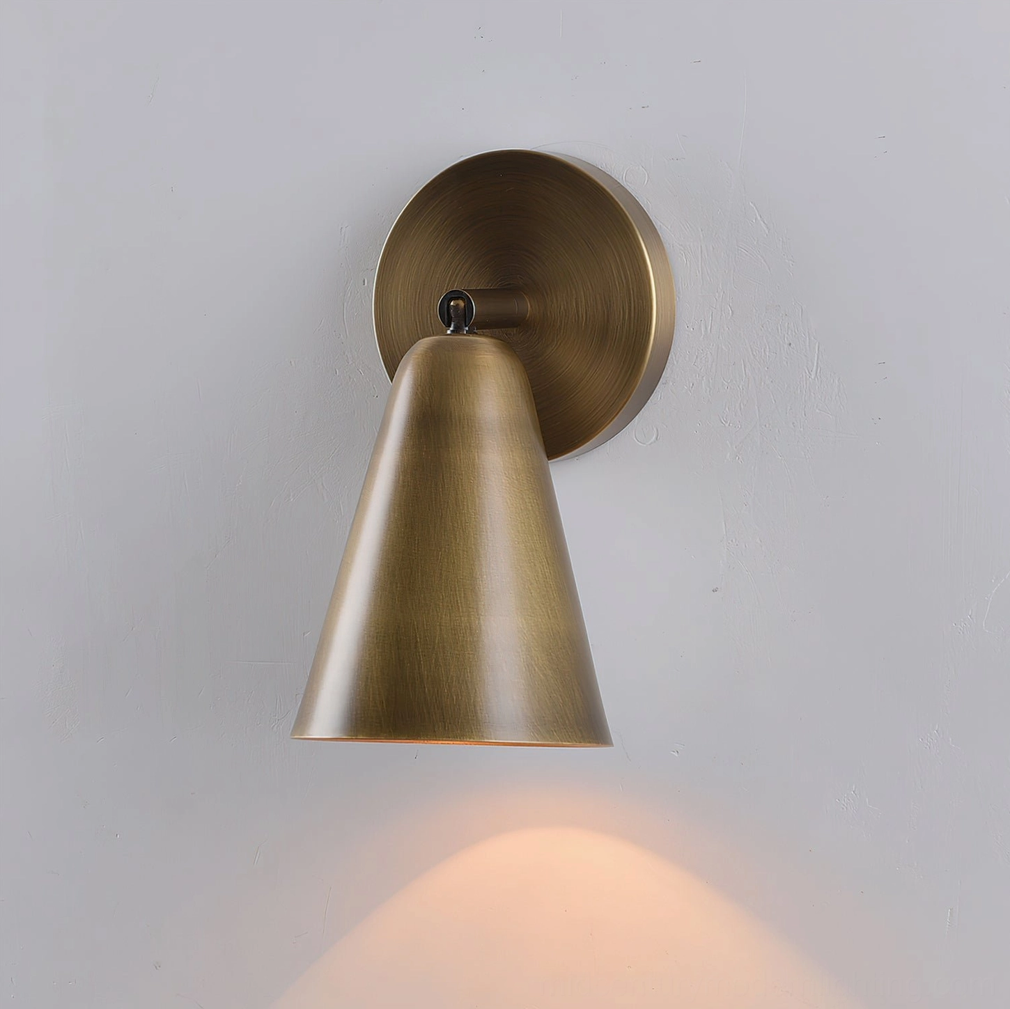 Donna adjustable sconce showing precision tilting capability for directional lighting