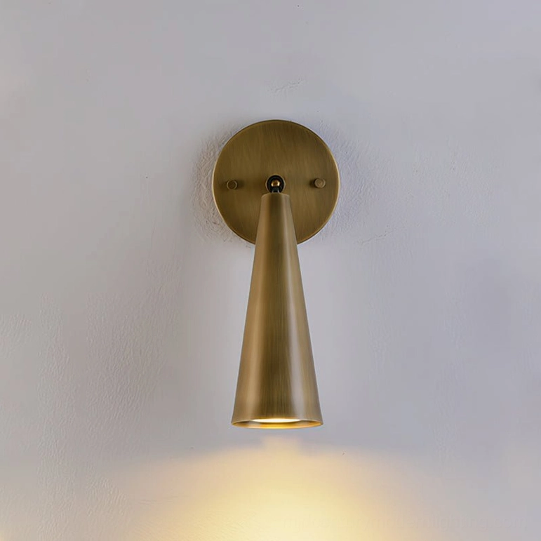 Donna antique brass sconce in polished finish showing rich patina and surface texture