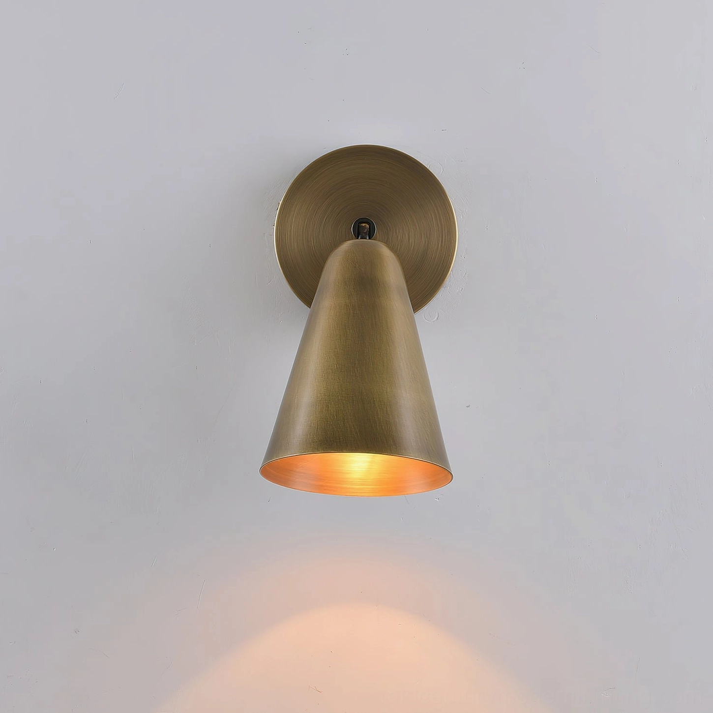 Donna swivel sconce in antique brass finish with adjustable directional lighting capability