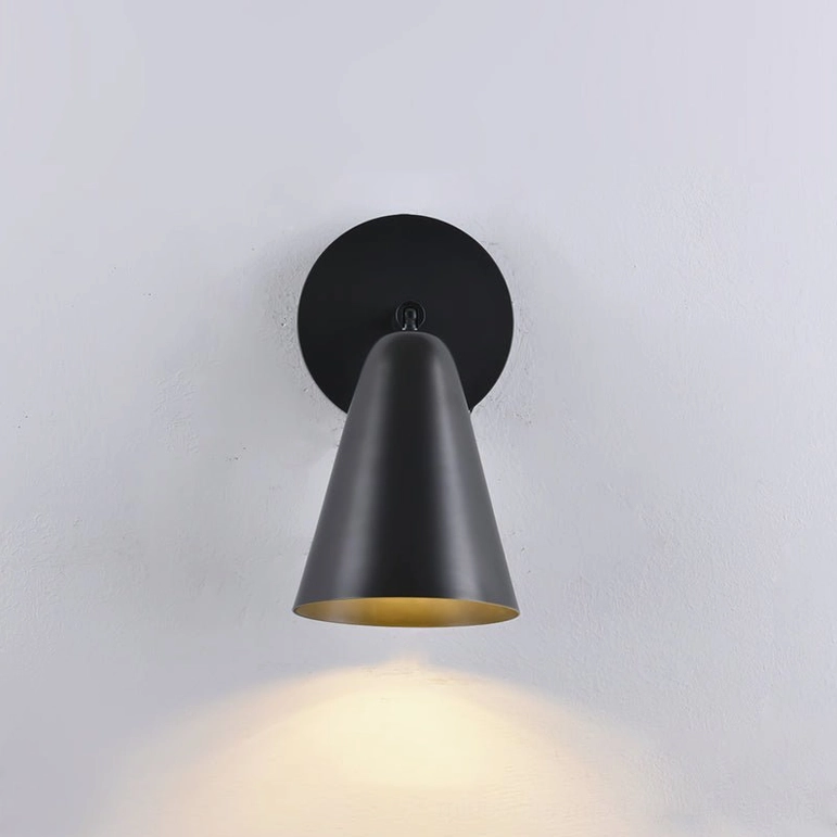 Donna black finish wall sconce with modern sculptural cone shade appearance