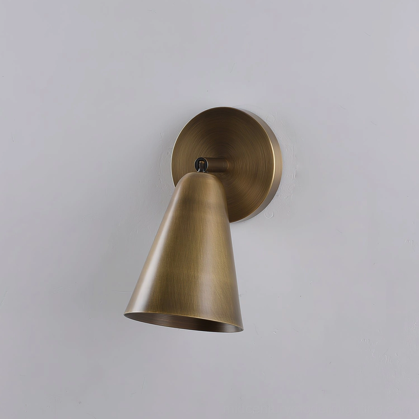 Donna wall-mounted sconce showing complete fixture assembly and solid brass construction