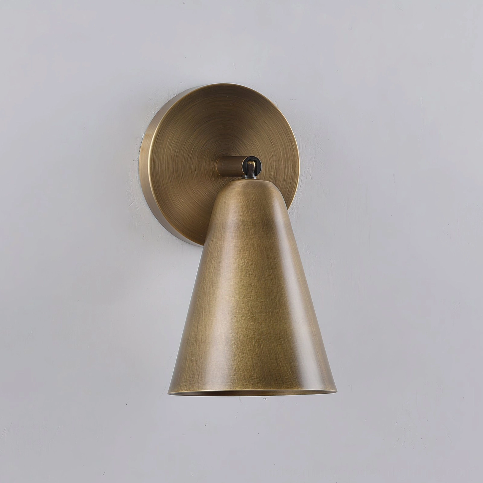 Donna swivel sconce installed as dual fixtures creating layered gallery lighting effect