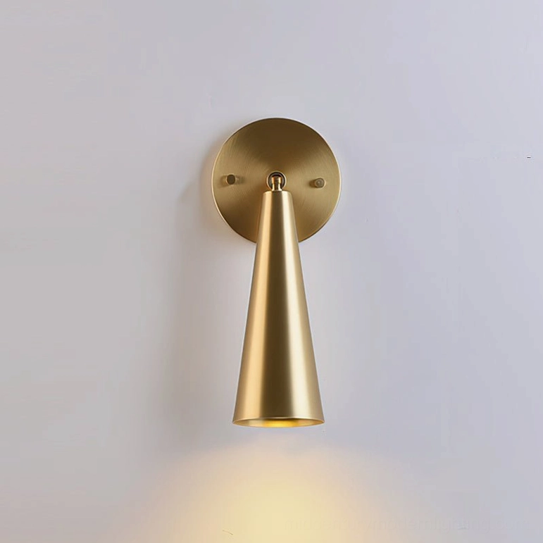 Donna polished brass wall sconce with contemporary warm metallic shine