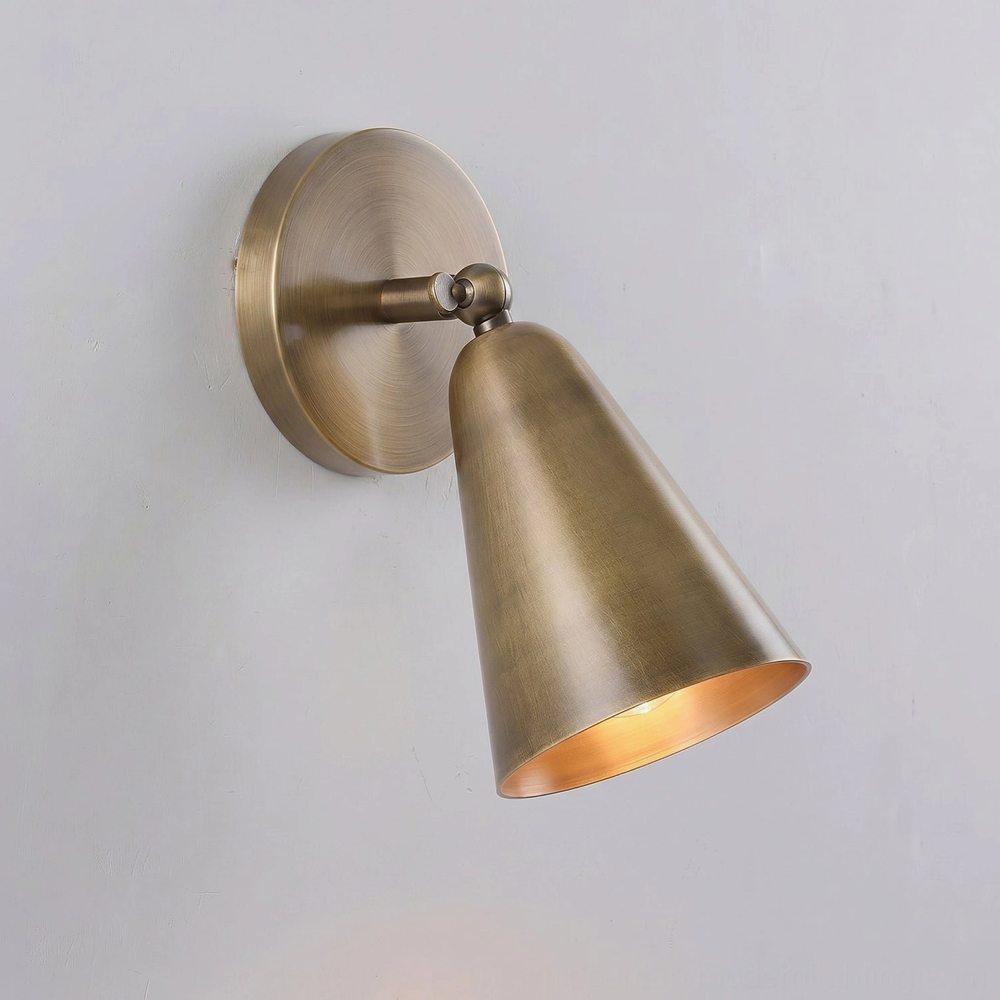 Donna swivel wall sconce close-up of brass finish and engineering details