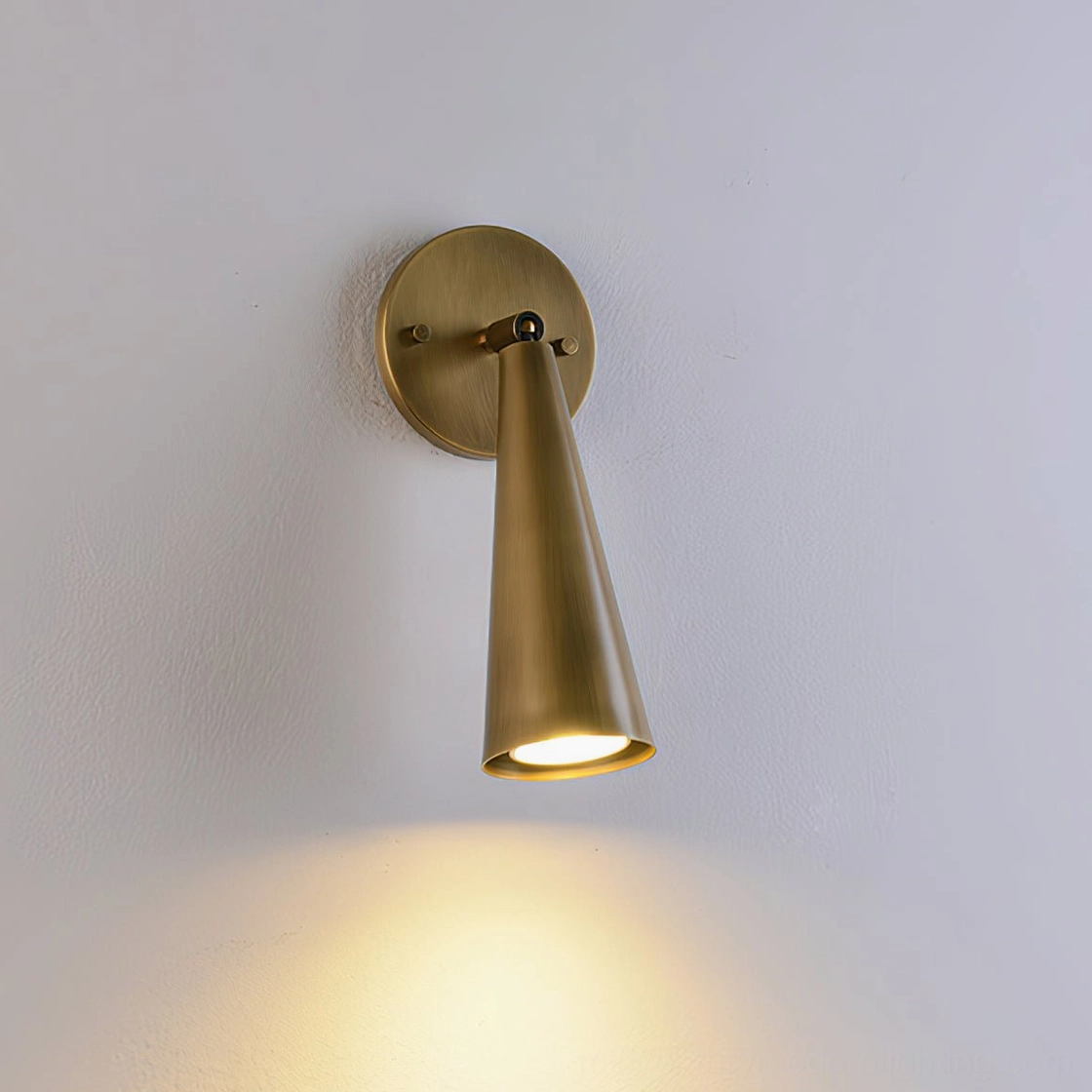 Donna swivel sconce product display on neutral wall background studio photography