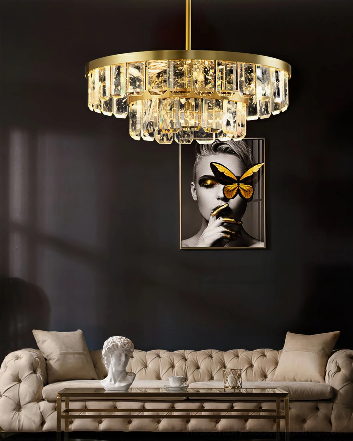 Two-tier round crystal Doria chandelier in luxury living room with portrait art and warm brass lighting