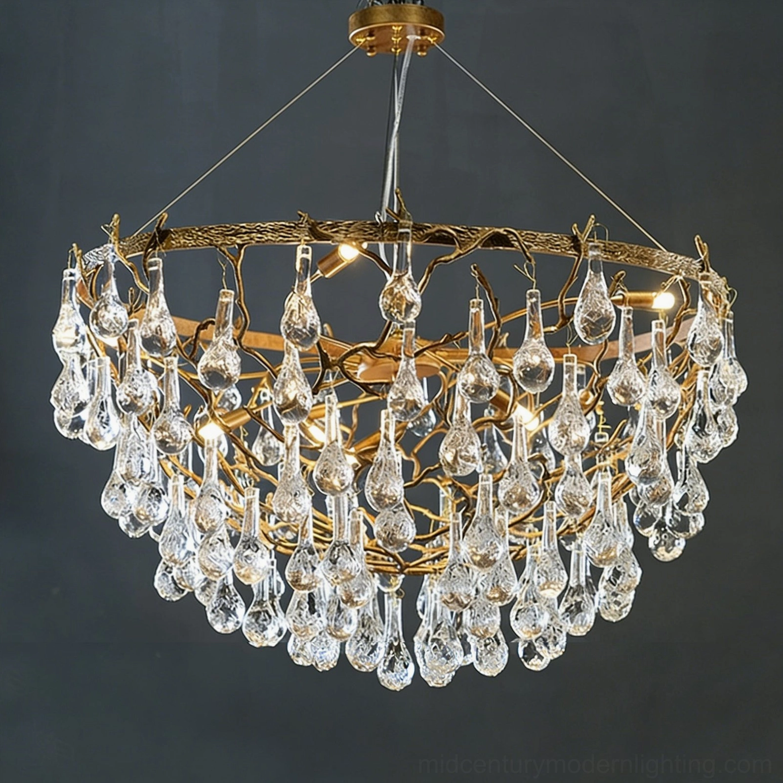 Doris crystal chandelier detailed close-up highlighting visible G9 bulb sockets and hand-finished antique brass twig framework with texture