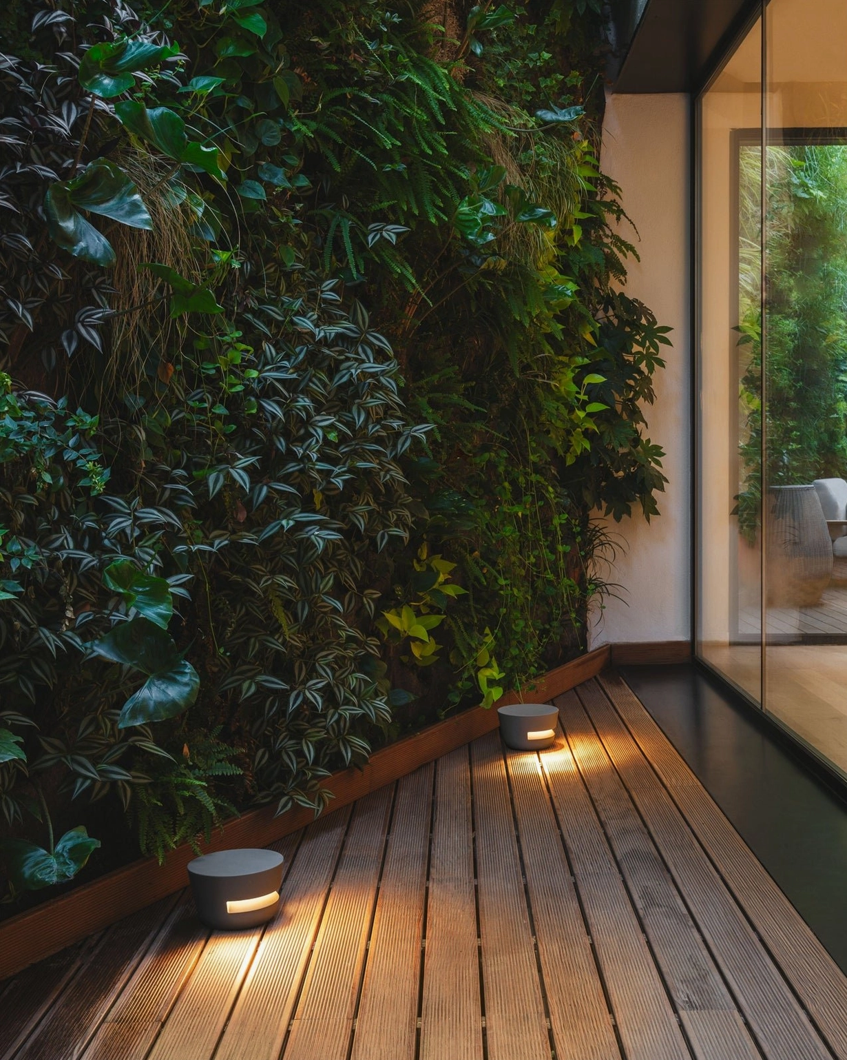 Dots outdoor table lamps on wooden deck - dual-layer cylindrical design with integrated LED warm white light