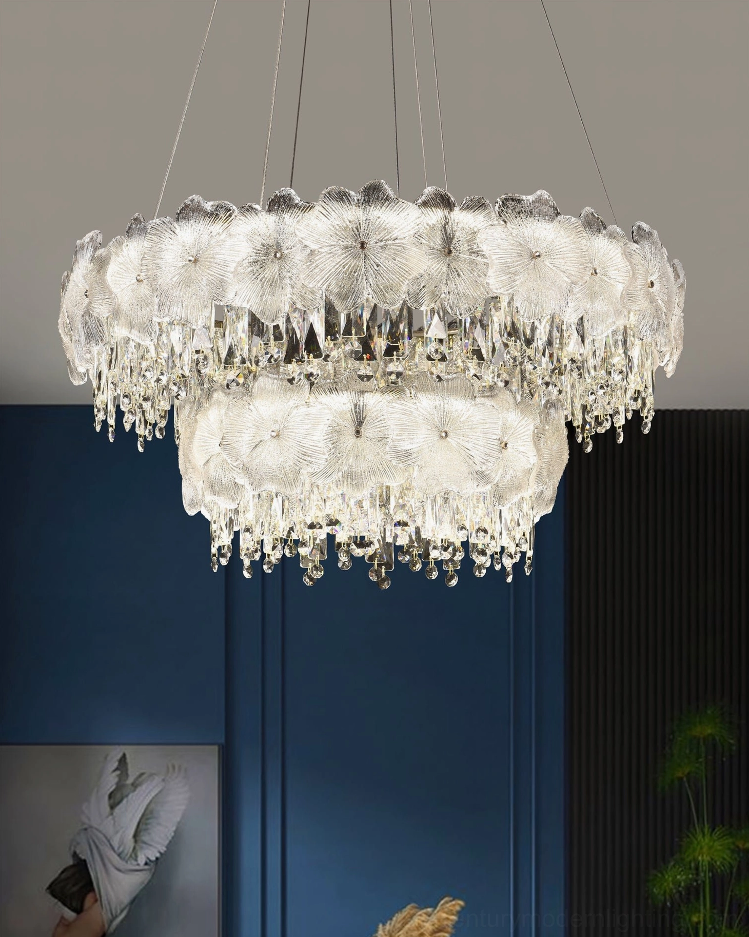 Double-tier crystal chandelier modern interior design two-layer floral glass trim against contemporary blue wall accent