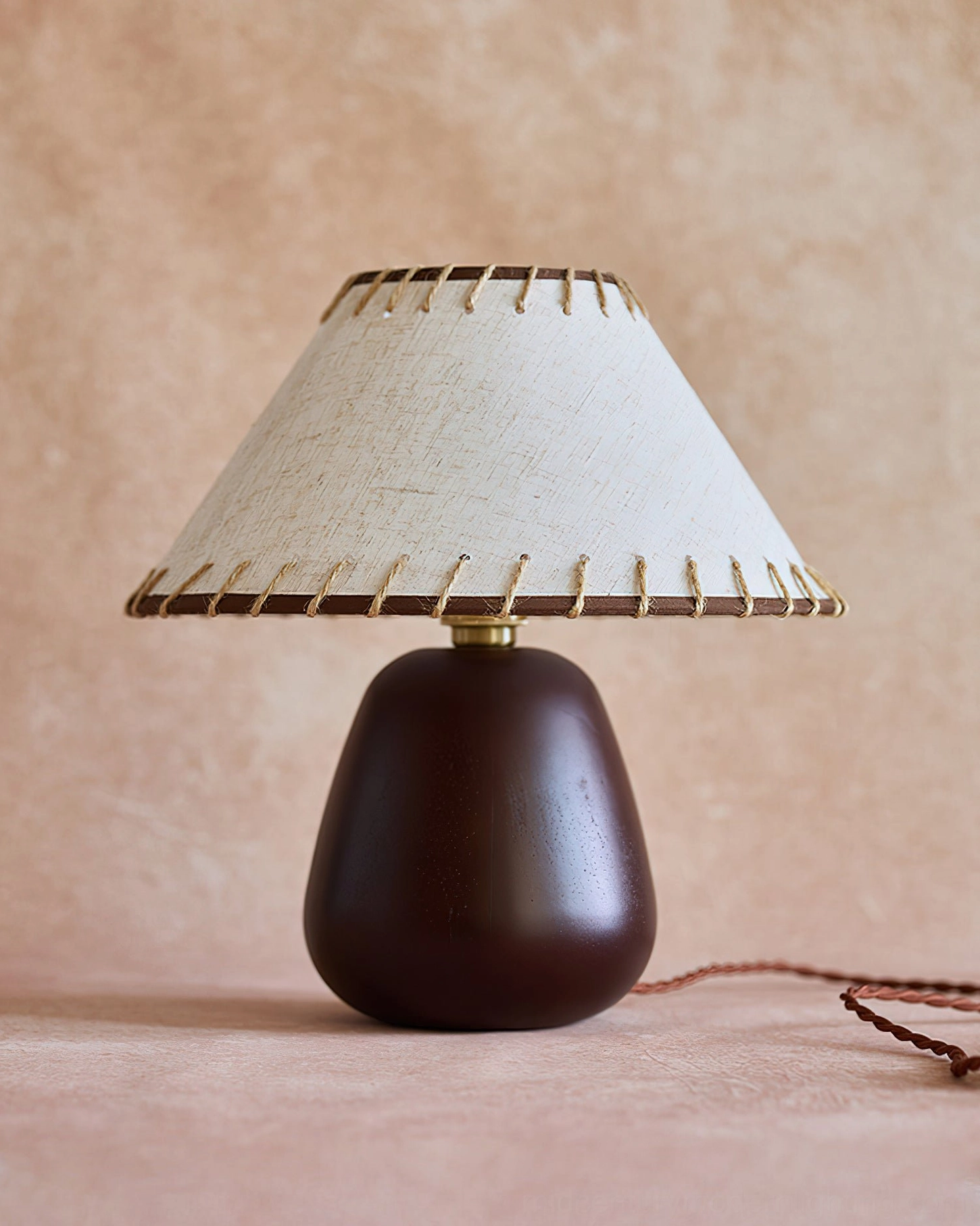 Douglas walnut lamp detail showing gold metal joint connector between base and socket