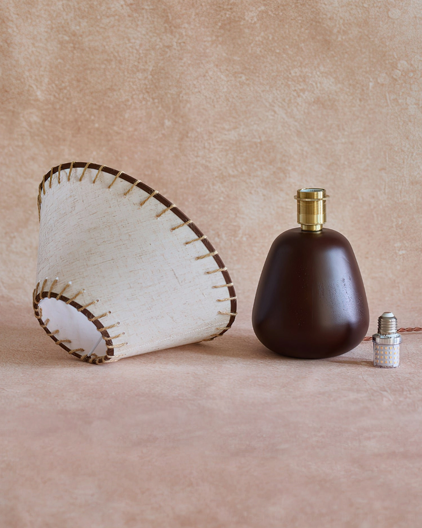 Douglas walnut table lamp alternative angle showing shade construction and natural linen texture