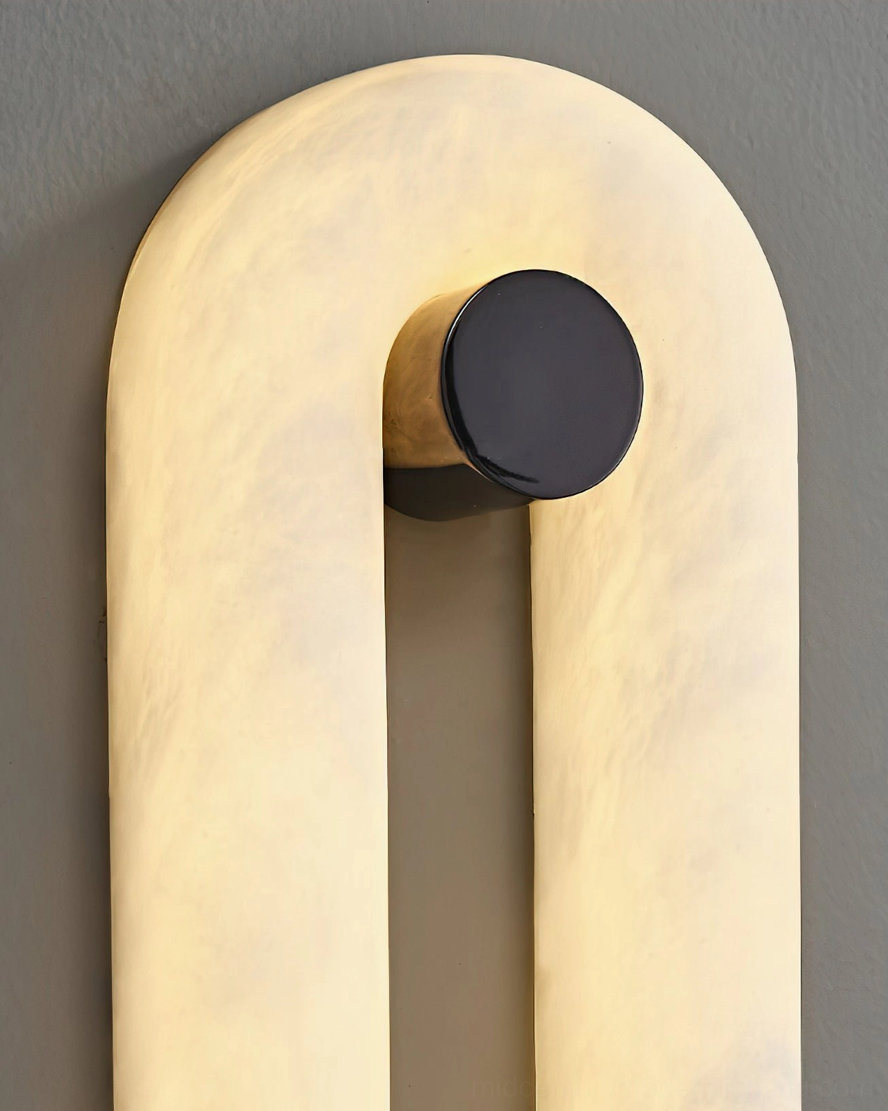 Dromo alabaster sconce close-up side view showing smooth rounded edges and natural marble veining