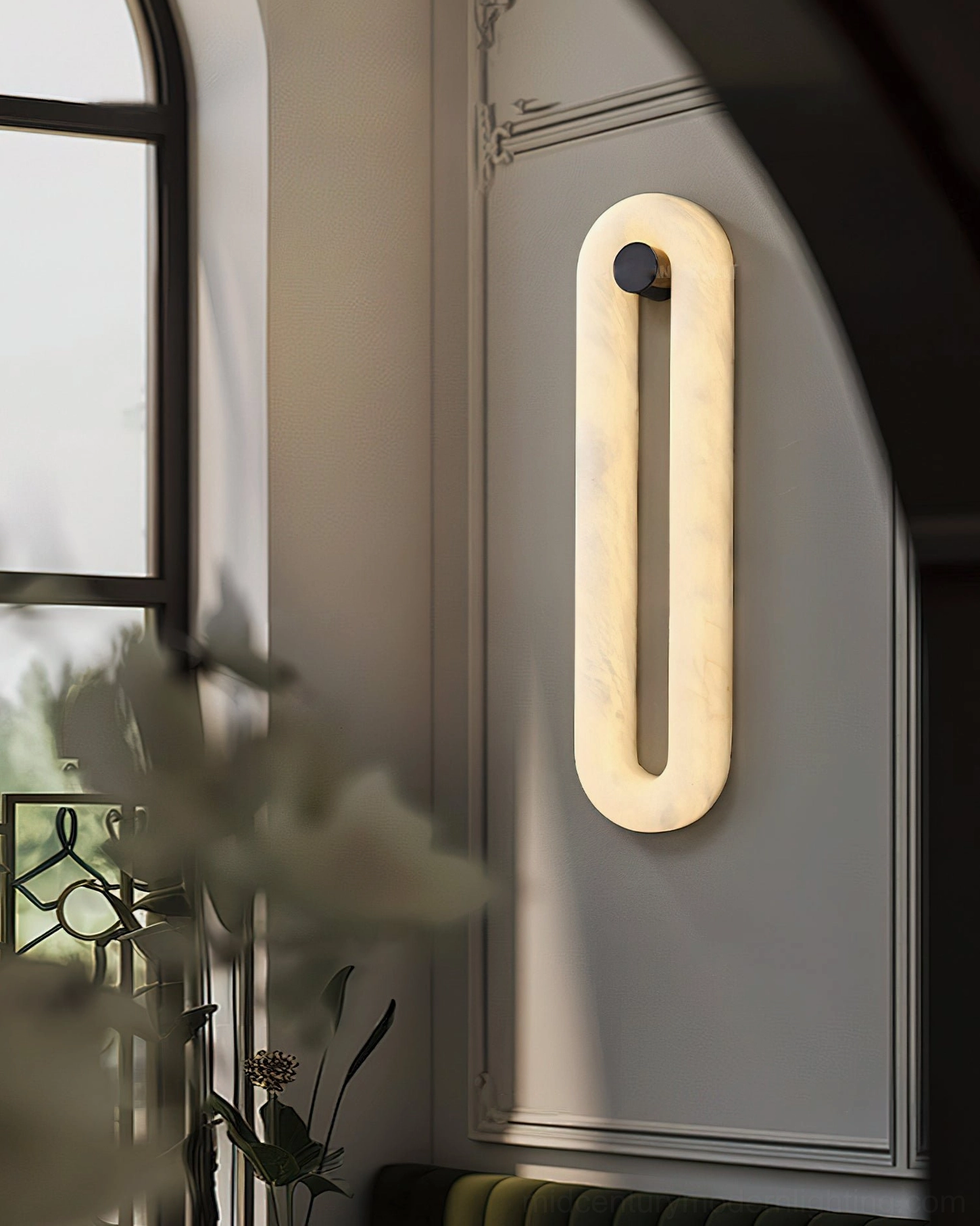 Dromo alabaster sconce side view in neoclassical dining room with vintage wainscoting, ambient lighting