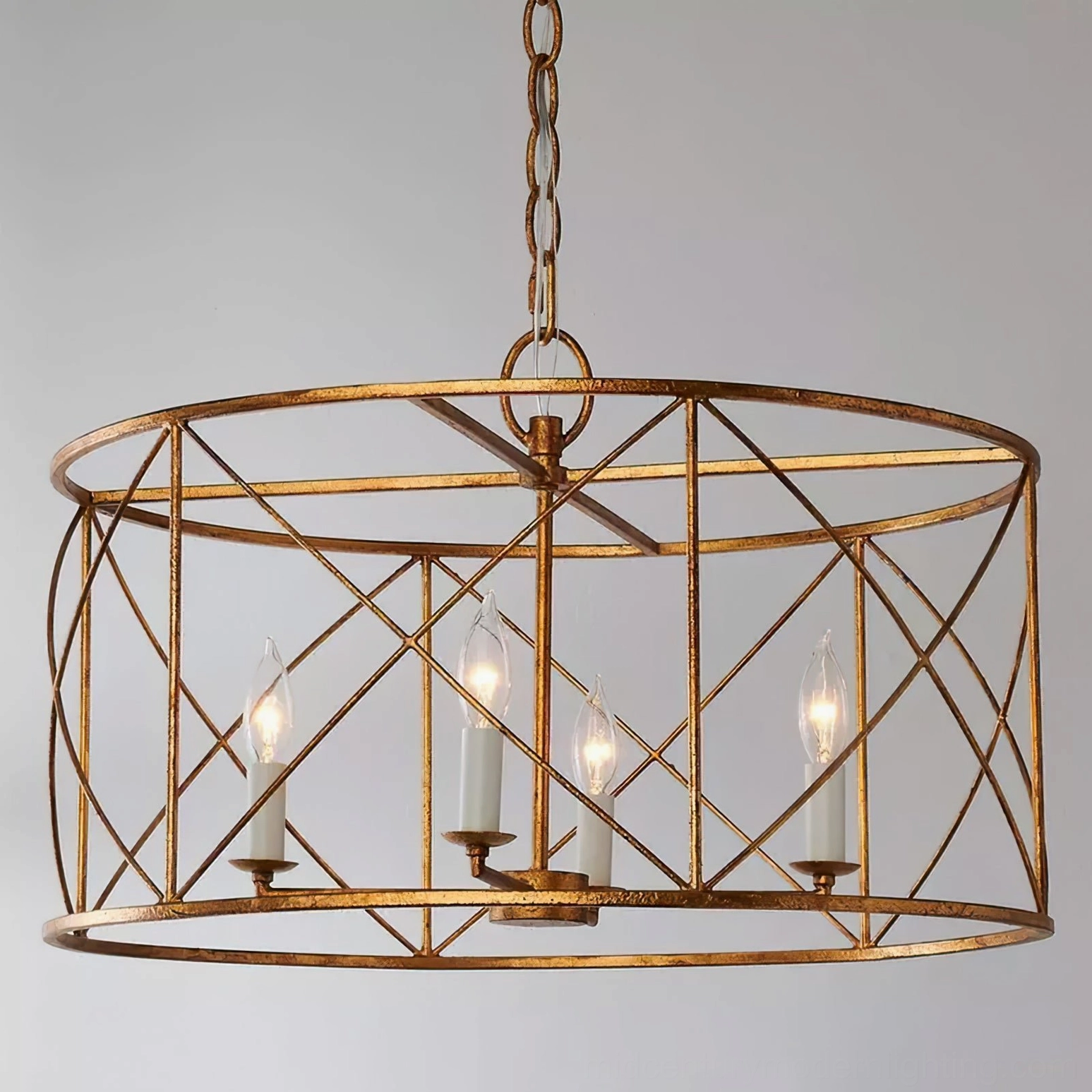 Mid-century modern drum cage chandelier with open cylindrical metal lattice design, 4 candle bulbs visible through geometric grid pattern