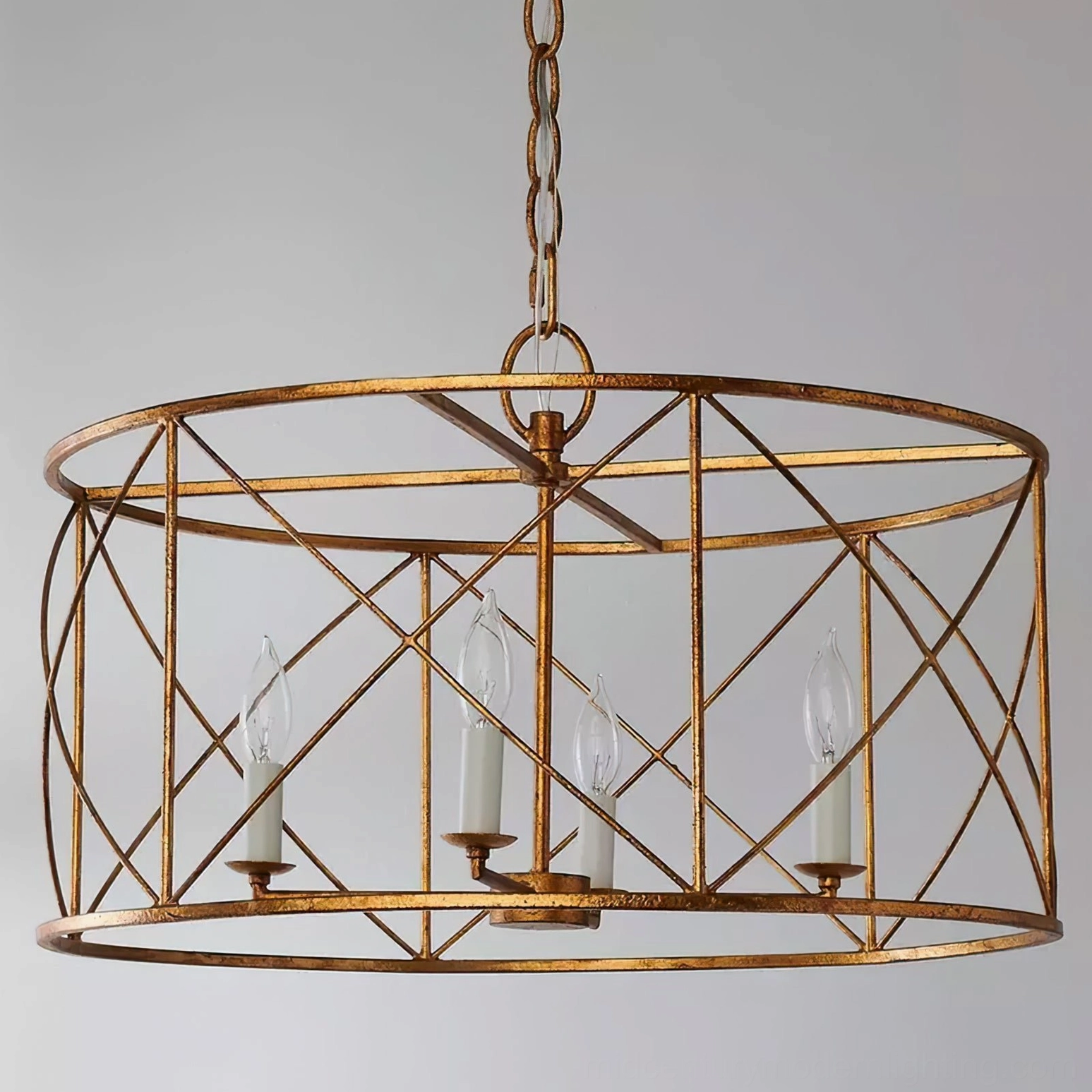 Distressed gold drum cage chandelier with circular metal frame and 4 candle bulbs, three-quarter view showing cage geometry