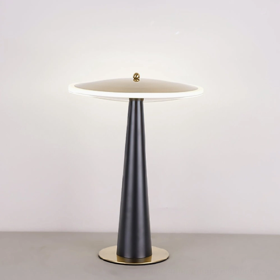 Illuminated drum table lamp with translucent acrylic diffuser on light gray surface