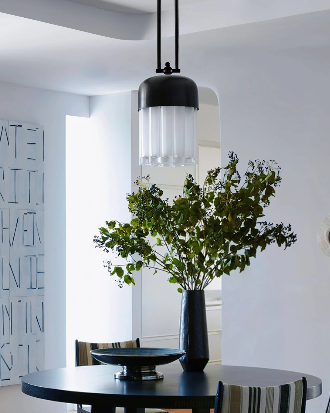 Minimalist black pendant light showing dual-rod suspension system and clean architectural design for modern interiors