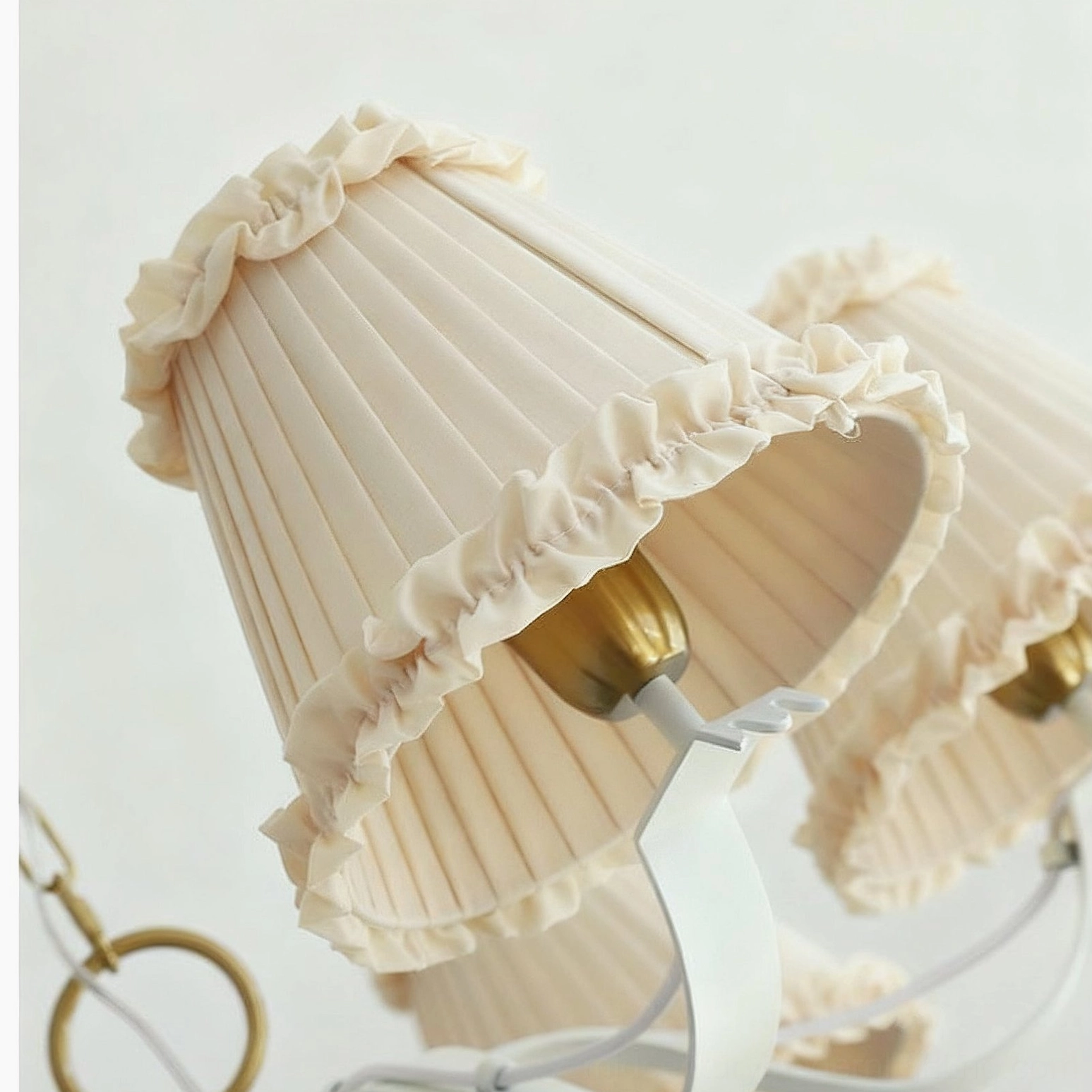 Close-up detail of fabric chandelier showing pleated ruffled shade construction and quality craftsmanship