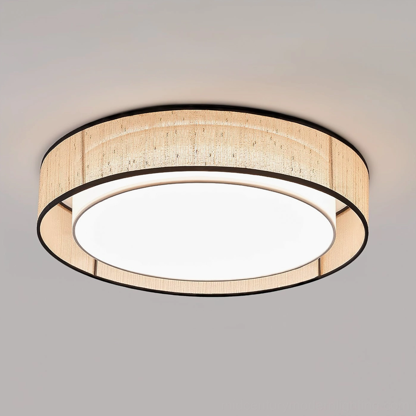Close-up front view of Duolla flush mount ceiling light showing beige woven jute fabric dome with black metal trim edge