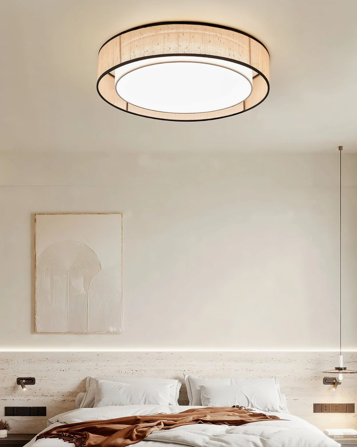 Minimalist bedroom with Duolla round ceiling light mounted flush to white ceiling showing even glare-free light distribution