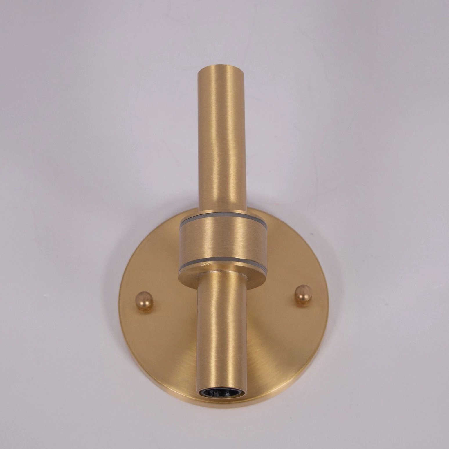 Elegant blown glass wall sconce with warm light creating atmospheric ambiance in home interior
