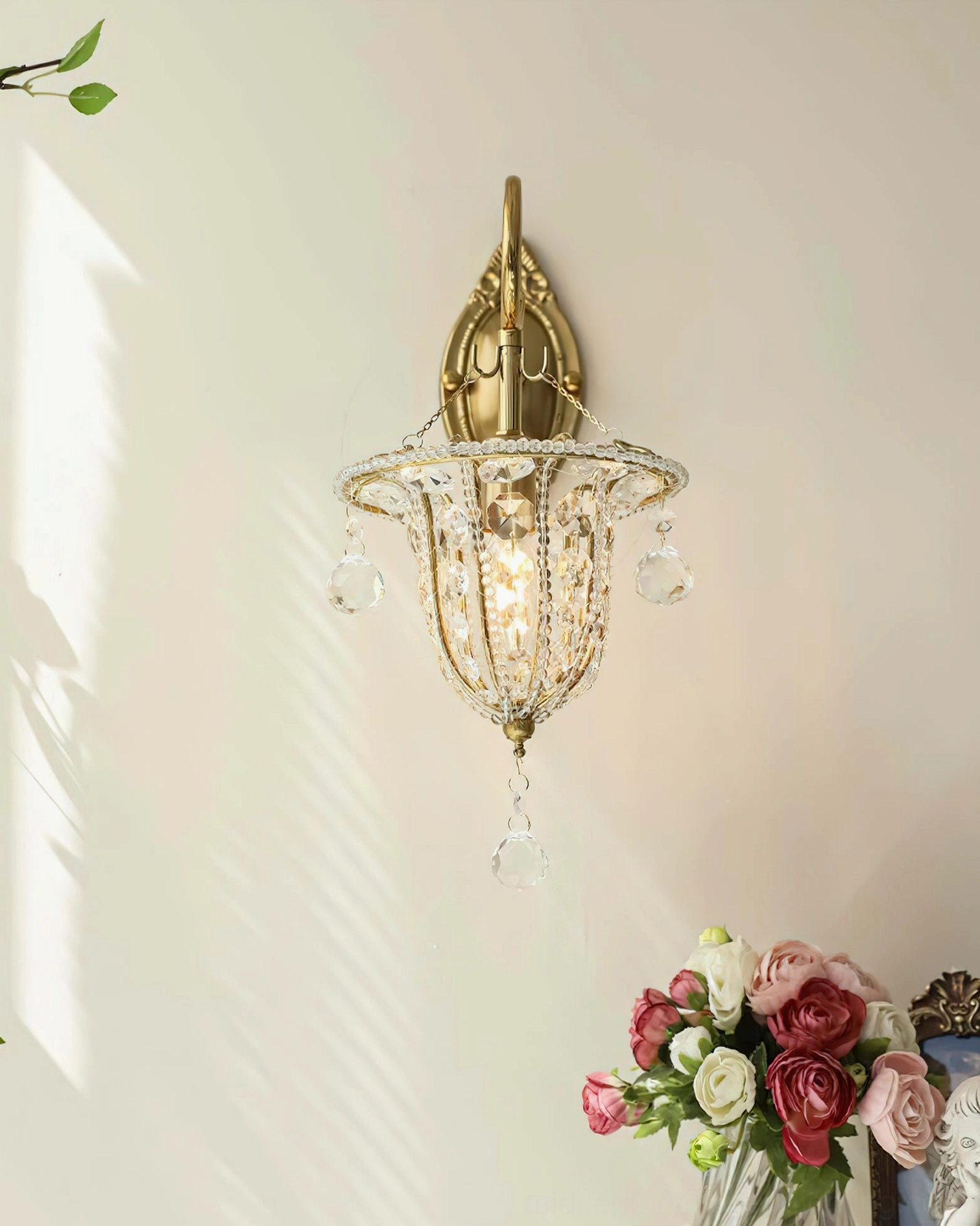 Eilers vintage luxury crystal wall sconce full view showcasing gold hardware, hanging crystal ornaments, and refined brass construction on neutral wall
