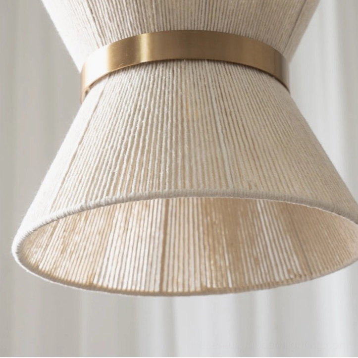 Elara woven pendant light in bohemian interior setting with sheer curtains and soft natural lighting, demonstrating ambient warmth
