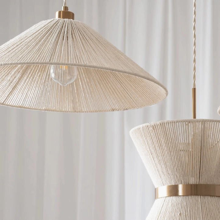Detailed macro shot of Elara woven pendant light shade showing tight handwoven cotton rope construction with dual polished gold metal bands