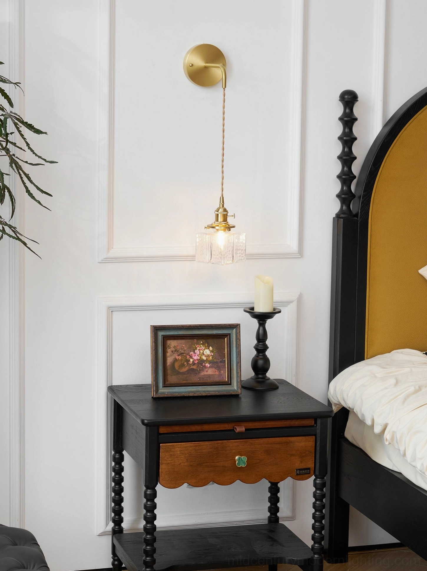 Elegant vintage brass wall lamp with square rippled glass shade in styled bedroom interior