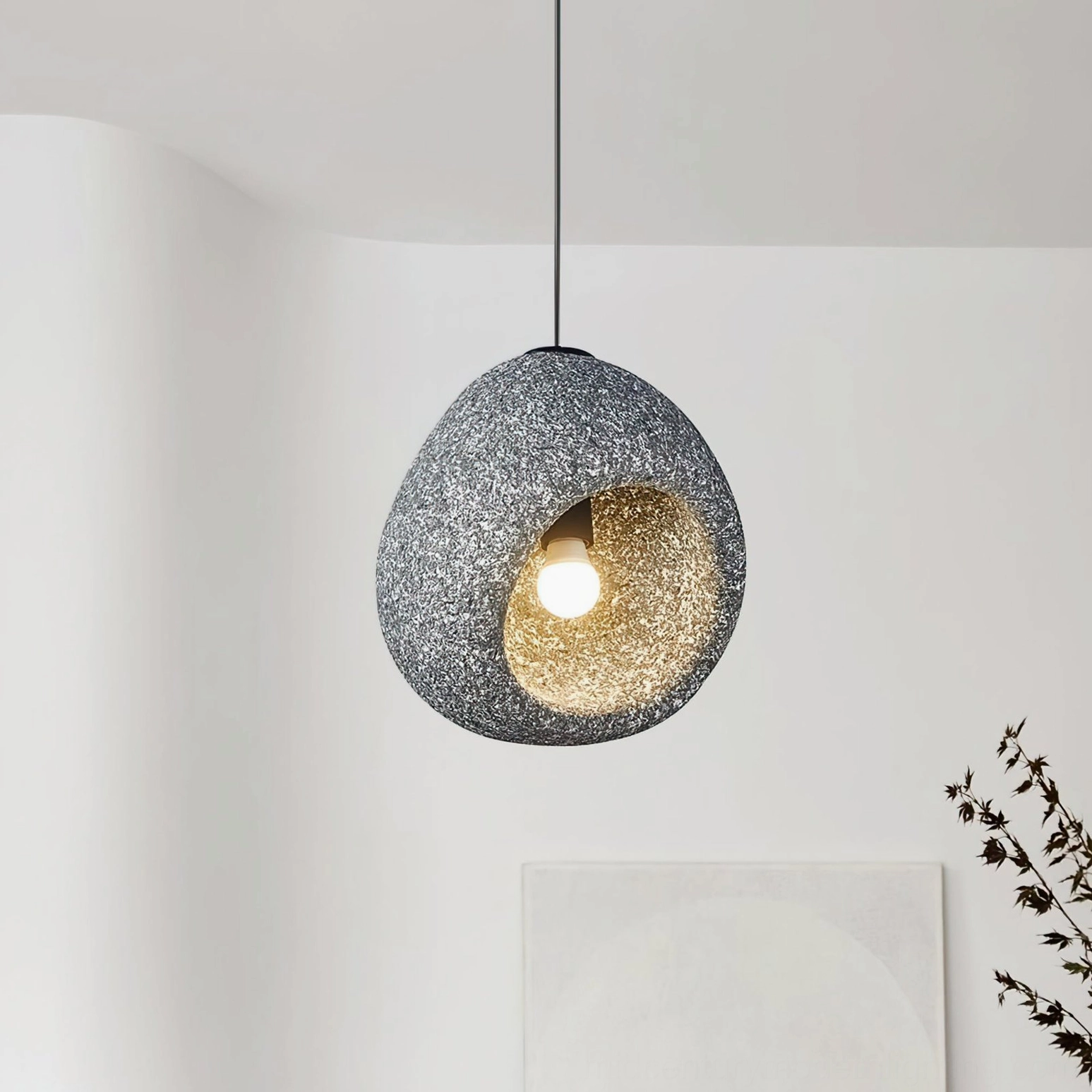 Elian stone pendant light in modern minimalist interior showing artistic form and subtle texture variations