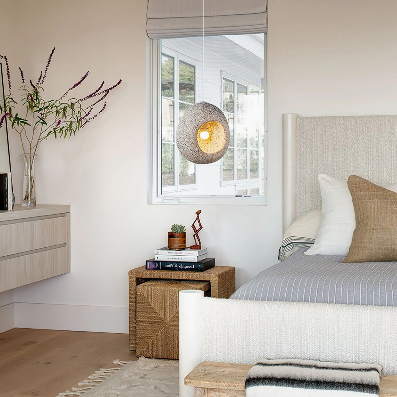 Elian pendant lamp hanging beside modern bedroom window with cozy neutral warm decor