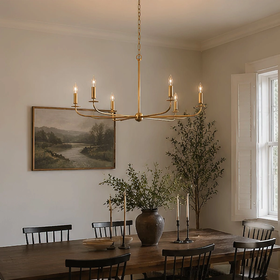 Emaani Candle Chandelier in contemporary living space with neutral decor, 8-light brass overhead fixture