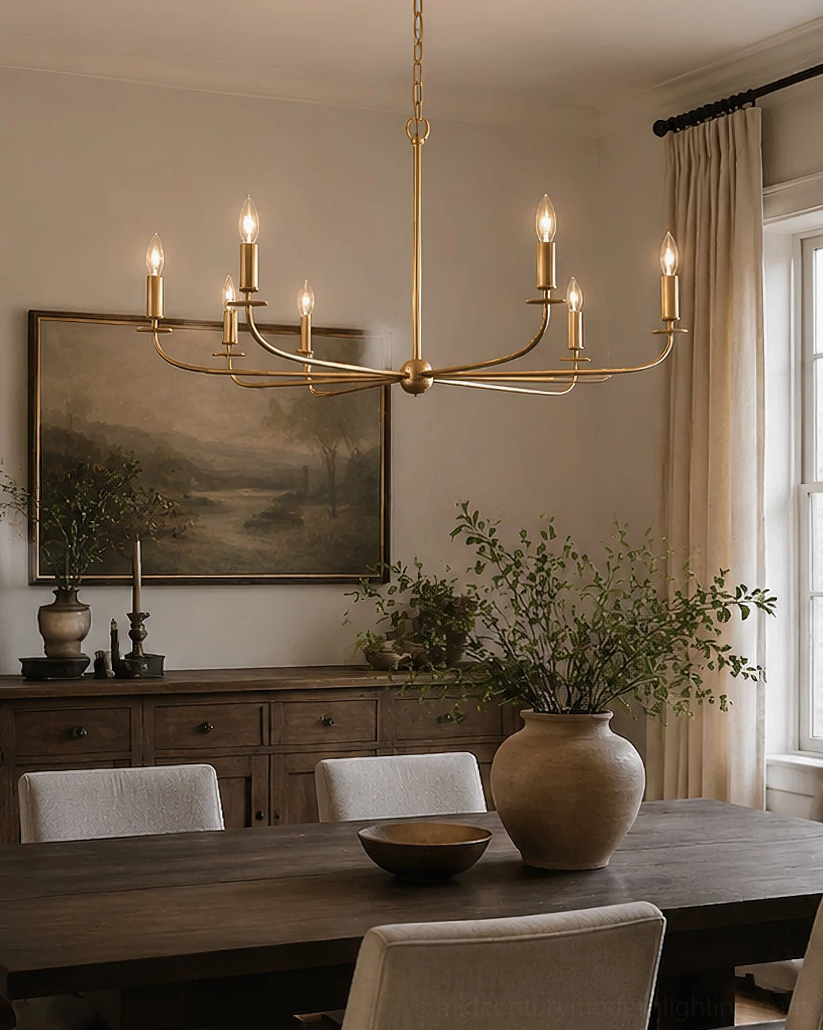 Emaani Candle Chandelier with 8 unshaded candle lights in traditional dining area, warm brass finish overhead view
