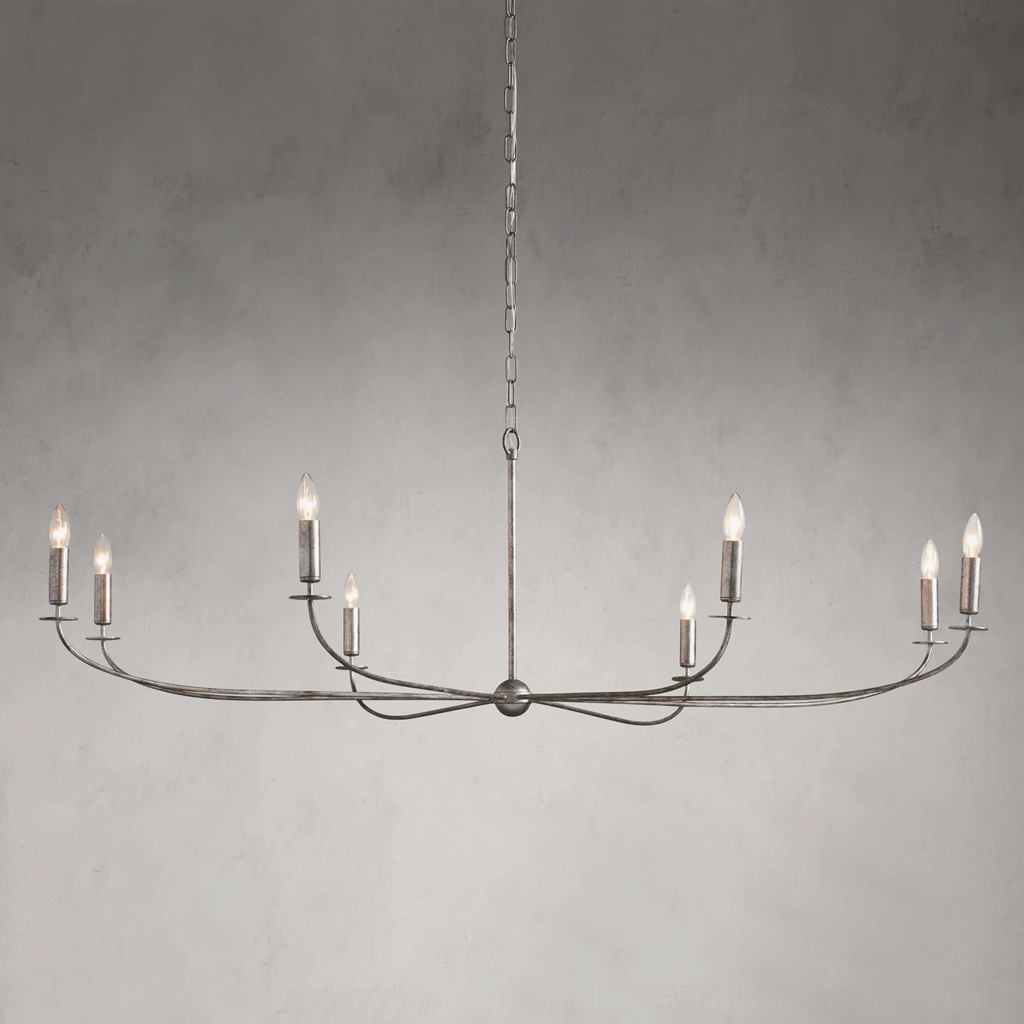 Emaani Candle Chandelier in matte Black finish, modern statement lighting with curved brass arms